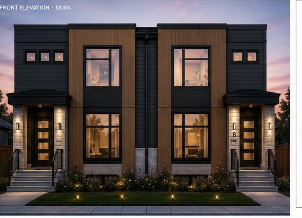 Modern duplex designed and built — dusk front elevation